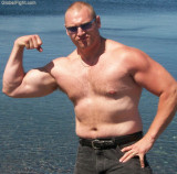 hairy dad flexing beach.jpeg