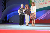 Denise Waddell (center) on stage for her 20 year award as demonstrator. Denise is Gina's direct upline.