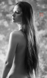 Long hair down her back, implied B&W