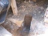 under the old fireplace