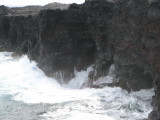 Waves flow into lava tube and back out