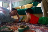 Omer is reading yo grandma his favorit book.jpg