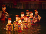 The puppets are made out of wood and then are lacquered. The shows are performed in a waist-deep pool.