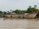 A closer view of the wooden boat.
