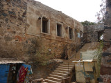 Steps leading alongside an ancient looking building.