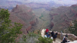Tourists taking in the view from a precipitous South Rim vantage point.