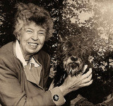 A happy photo of Eleanor Roosevelt with Fala, which symbolizes the true happiness that she found living at Val-Kill Cottage.