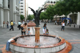 Kids playing by a fountain in Administration Square.