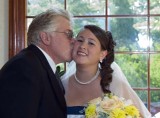 A kiss before the Bride is escorted down the aisle.