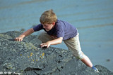 A child was climbing rocks