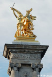 Statue on the granite pillar of the Alexander III bridge 02