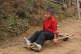 Boy with a typical Naga toy in Wanching.