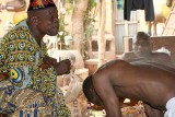 Voodoo priest in Abomey during a healing ceremony.