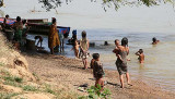 Kachork people taking a bath in Tonl San River, Cambodia.