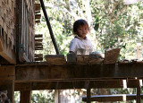 Girl on a porch in Koh Peak, Cambodia.