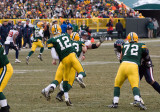 Aaron Rodgers (12) throws downfield