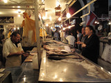 Fish monger and customer at Mercado central