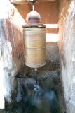 Water powered prayer wheel.