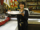 Dawn holding the platter of fish to be served for lunch