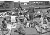 USS Indianapolis -  Survivors on the USS Bassett  - Sitting on deck (7)