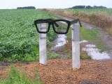 Glasses mark the trail to the Buddy Holly crash site