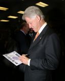 President Clinton graciously signing...