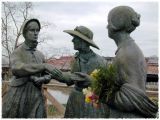 suffragettes holding flowers...