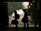 Tourists departing Old Faithful Inn, Yellowstone National Park, Wyoming, 2008