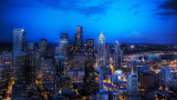 nightshot of seattle skyline w/mount rainier in the background from the space needle