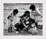 Pamapanga, Philippines. Cheap Thrills. One member of our group shows a digital picture to some of the locals