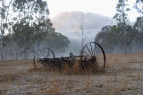 Old farm machinery in the dawn light