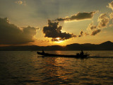 Boat at sunset on Inle Lake.jpg