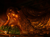 Golden buddha Hpo Win Daung caves with offerings.jpg