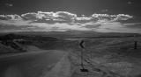 IMG03201 road on high desert plain bw.jpg