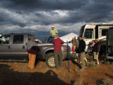 Corwin setting up tent under threatening skies