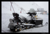 Snow Plastered Snowmobile