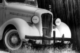 yellow classic car in black and white