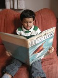 Rahil reading The Chas Addams Mother Goose