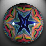 A murrine N is trapped in a complex fumed Web(er), while its companion N blazes forth in glory on the gorgeous backside.