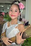 Nervous young Thai girl before performance with percussion instrument