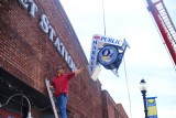 installing new Public Market & oz signage