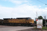 UP 6804 passes sign that states, CNW Main Line.JPG