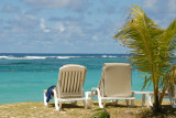 Beach chairs with blue water, Shandrani Hotel, Mauritius