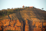 Cliffs honeycombed with caves west of central Xining