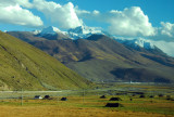 There are large mountains on the other side of the river as well