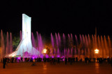 Monument to the Peoples Liberation of Tibet and the Potola Square fountain at night, Lhasa