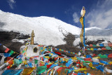 Prayer flag covered stupa beneath Mt Nojin Kangtsang