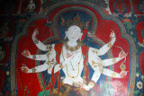 The murals on the walls, like this White Tara, survived better