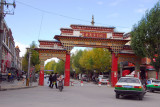 Tibetan gate to pedestrianized Buxing Jie street, Shigatse
