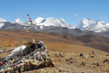 Lapche Kang massif with prayer flags on windy Tong-la Pass